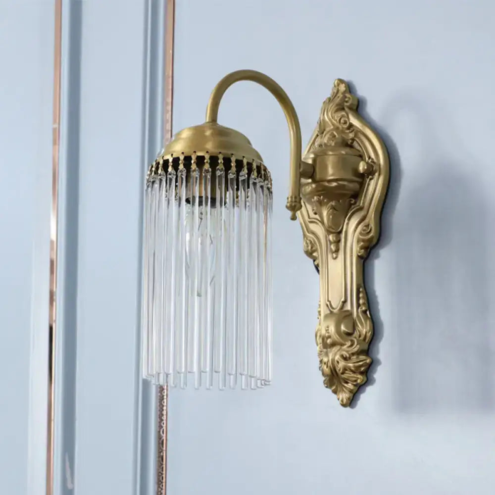 Antique brass crystal rod wall sconce with ornate backplate and cascading clear glass prisms for corridor lighting