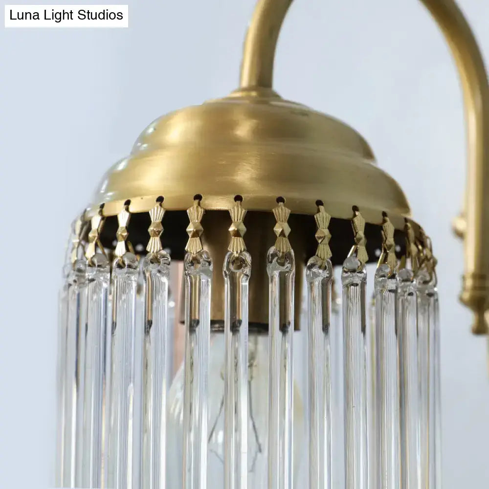 Antique brass crystal rod wall sconce featuring gold-toned brass chandelier with clear glass prisms and ornate metal fixtures