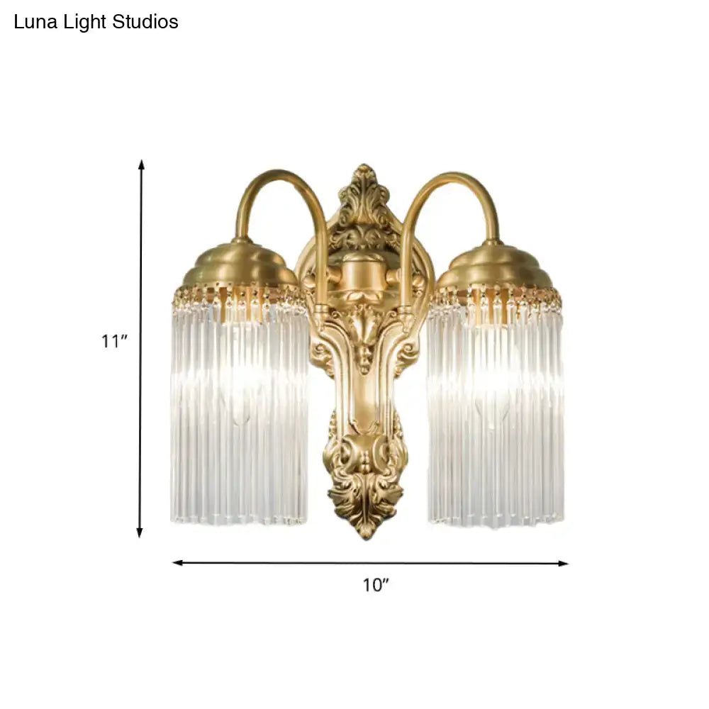 Antique brass crystal rod wall sconce with gold-toned ornate arms and clear glass shades for corridor lighting