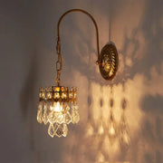 Antique brass crystal wall lamp with dangling crystal droplets and crown top for luxury bedroom decorbites wall lamp