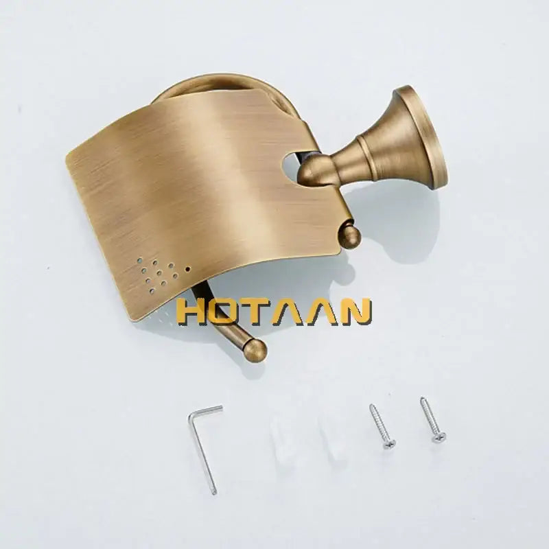 Antique brass curved toilet paper holder with brushed metal design and decorative perforated panel for bathroom use