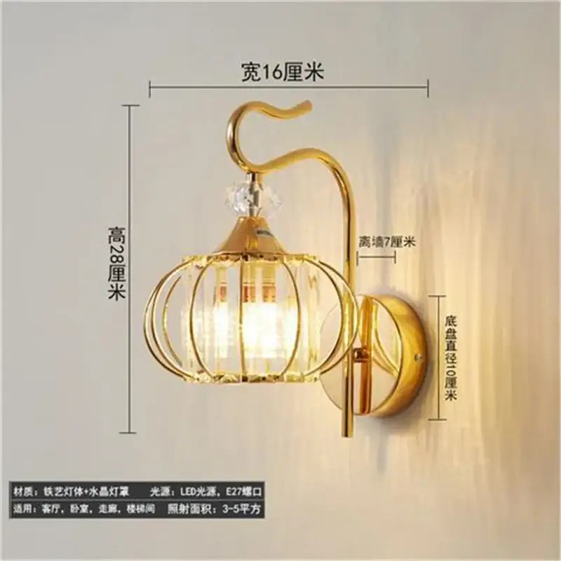 Gold-toned antique brass and dark bronze decorbites crystal led wall lamp with cage-like crystal led wall sconce arm