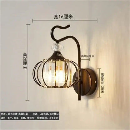 Vintage-style dark bronze metal wall lamp with clear crystal cage and decorative glass panels for living room decorbites crystal led