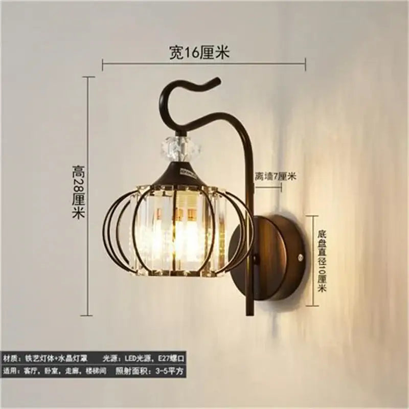 Vintage-style dark bronze metal wall lamp with clear crystal cage and decorative glass panels for living room decorbites crystal led