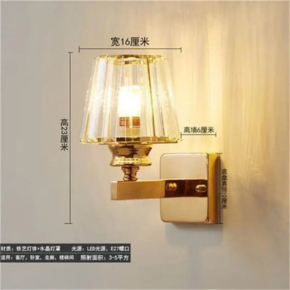 Gold-finished wall lamp with faceted crystal LED shade in antique brass and dark bronze for elegant decorbites crystal led wall use
