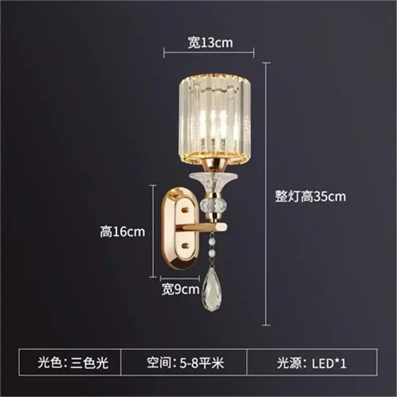 Gold-toned antique brass and dark bronze crystal led wall lamp with faceted crystal shade and teardrop pendant decorbites crystal led