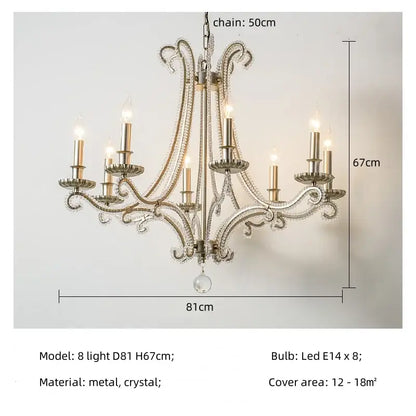An ornate silver decorbites crystal led chandelier with eight lit candle-style bulbs for living room lighting