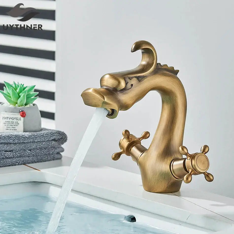 Antique brass decorbites dragon style bathroom basin faucet mixer tap with ornate detailing and dual cross-handle controls
