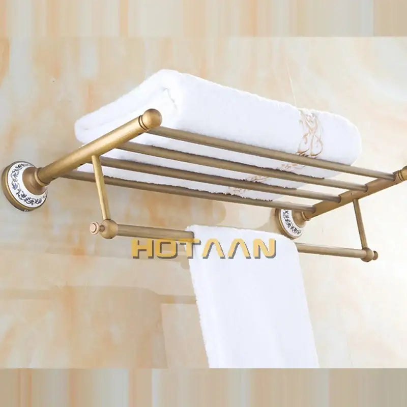 Antique brass double tier towel rack with decorative circular wall mounts and multiple horizontal bars towel holder
