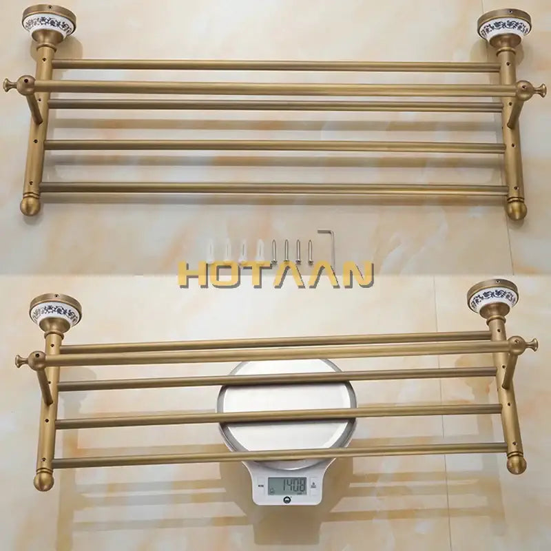Antique brass double tier towel rack with ornate ceramic end caps and multiple horizontal bars towel holder