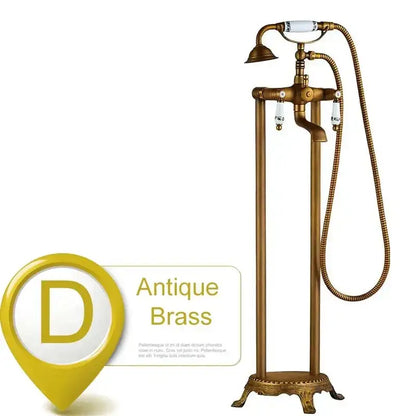 Antique brass freestanding tub faucet with decorbites dual ceramic handles and white ceramic accents with coiled hose