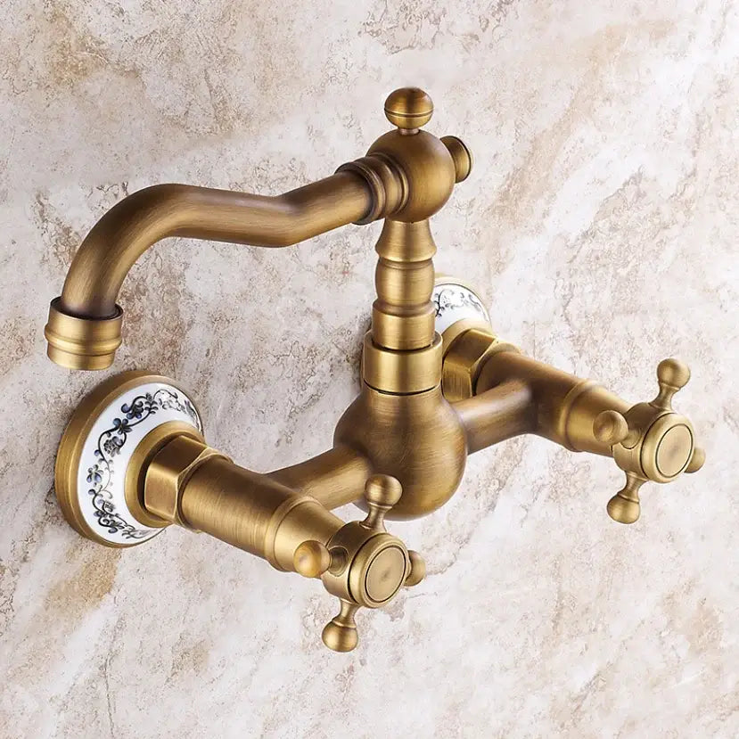 Antique brass dual handle kitchen faucet with porcelain plate and decorative black floral hot water knobs wall mounted