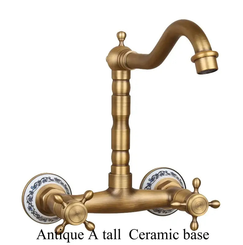 Antique brass dual handle kitchen faucet with hot water control and ornate porcelain plates with blue floral patterns