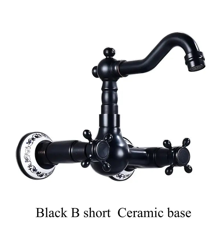 Antique brass dual handle kitchen faucet with black matte ceramic base and decorative white floral porcelain plates for hot water