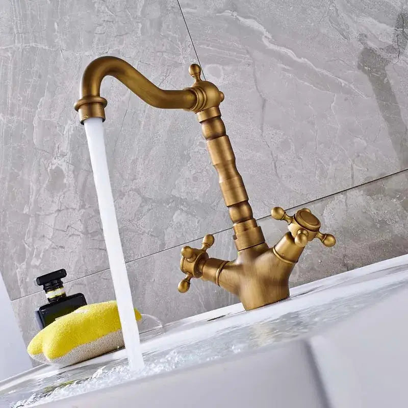 Antique brass dual handle swivel kitchen faucet with curved spout and two cross-handle knobs for decorbites dual handle sink