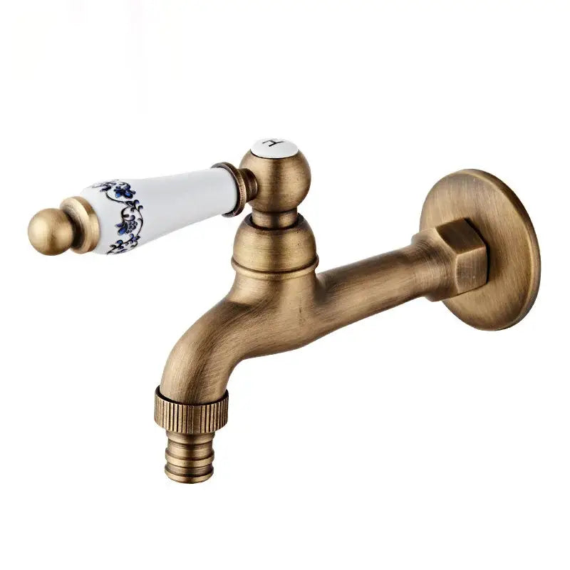 Antique brass floral ceramic wall mounted basin faucet with white ceramic handle featuring blue floral patterns