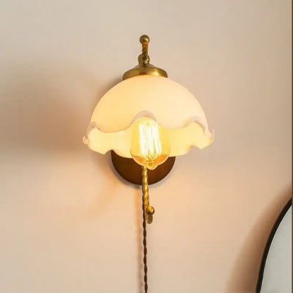 Antique brass floral frosted glass led wall lights with ruffled shade and brass accents for bedroom sconce lighting