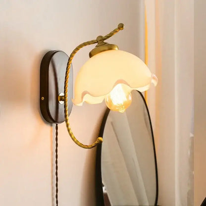 Antique brass floral led wall lights with frosted glass shade and twisted brass arms for bedroom sconce lighting