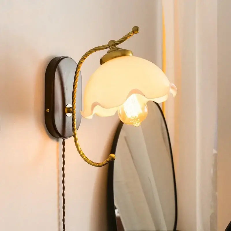 Antique brass floral led wall lights with frosted glass shade and twisted brass arms for bedroom sconce lighting