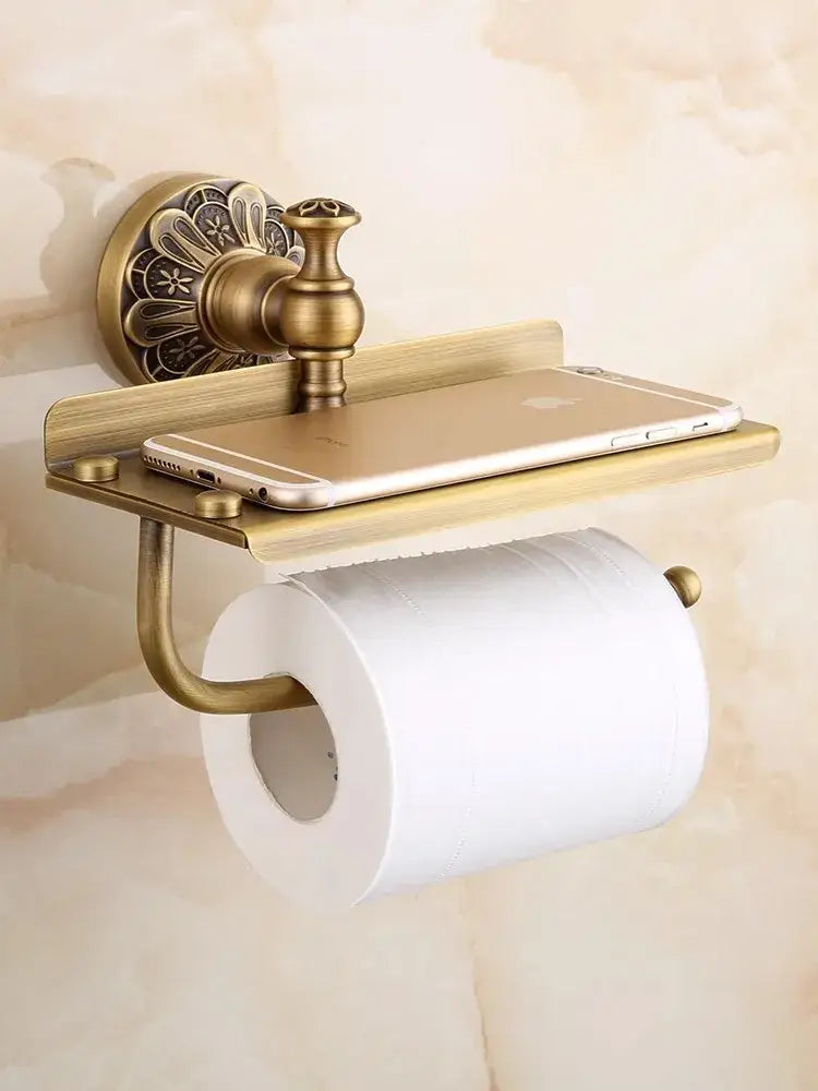 Antique brass toilet paper holder with ornate wall mount and shelf from decorbites brass bathroom hardware set