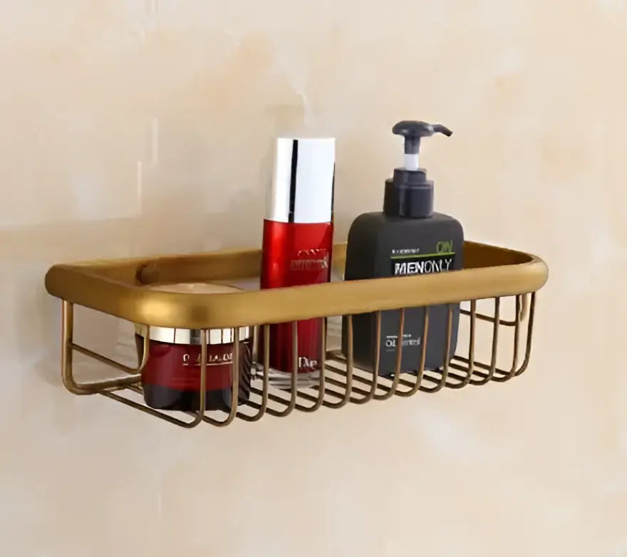 Gold-toned metal wire shower caddy in antibque brass floral bathroom hardware set for organized brass bathroom decorbites