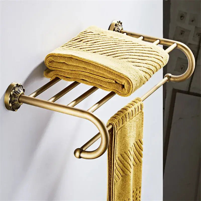 Antique brass floral double tier towel rack with ornate fluted ends in decorbites brass bathroom hardware set