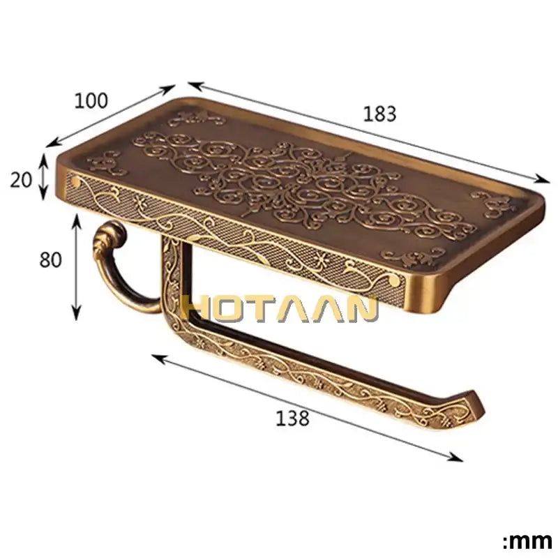 Antique brass floral toilet paper holder with ornate embossing and curved mounting bracket for bathroom use