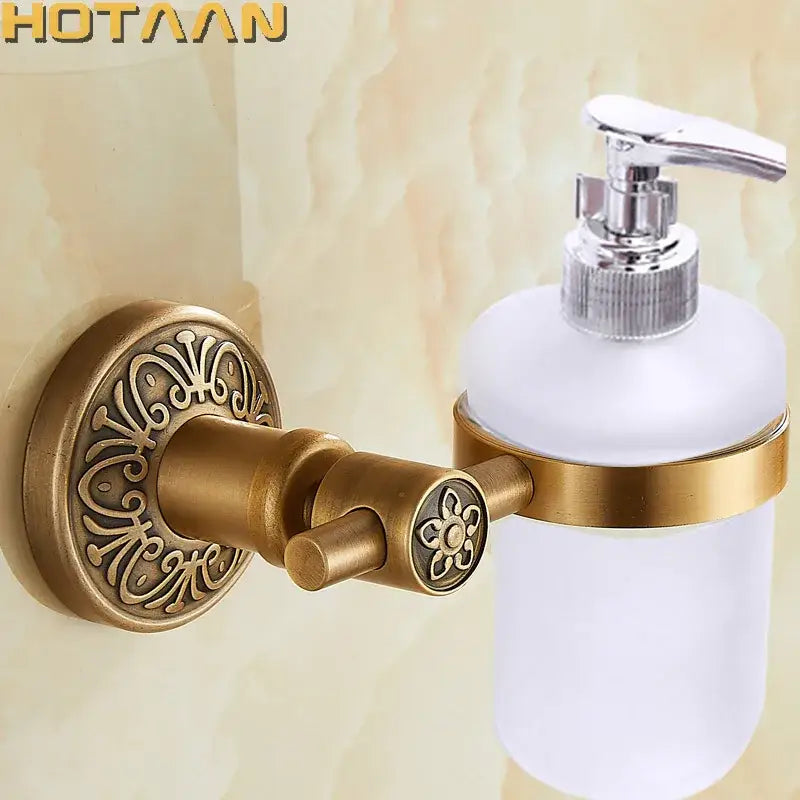 Antique brass floral soap dispenser holder with frosted glass bottle and chrome pump for bathroom use