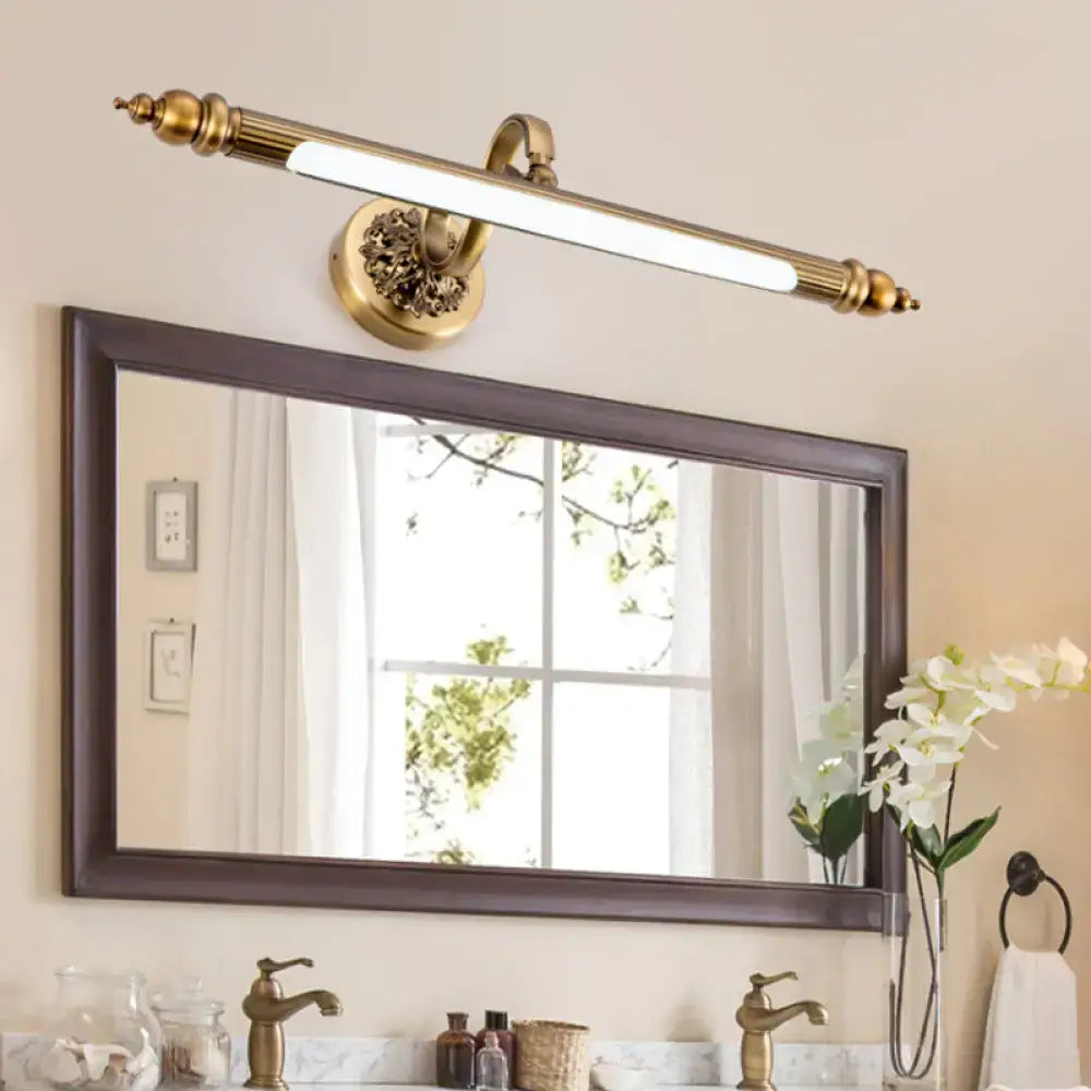 Antique brass floral vanity wall lamp with ornate detailing and warm white light in brass finish for bathroom use