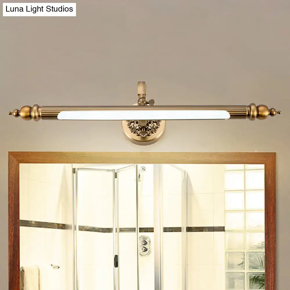 Antique brass floral vanity wall lamp with ornate detailing and sleek elongated led bar emitting warm white light