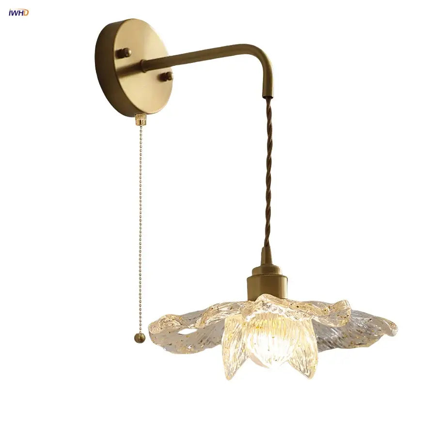 Antique brass flower glass led wall light with pull chain and twisted cord featuring an illuminated translucent shade