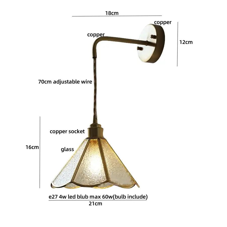 Antique brass flower led wall light with a textured frosted glass shade and pull chain for bedroom use