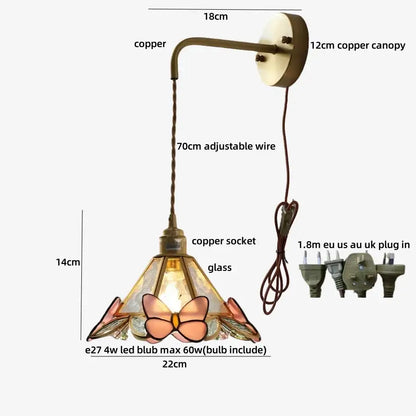 Antique brass led wall light with stained-glass butterfly design in pink amber hues for bedroom sconce with pull chain