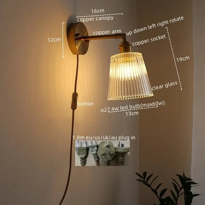 Copper-finished wall lamp with clear ribbed glass sconce led and adjustable arm for bedroom lighting