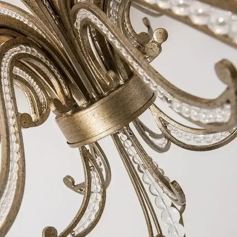 Antique brass french candle pendant lighting with intricate scrollwork and clear crystal beads for dining room decorbites french candle design