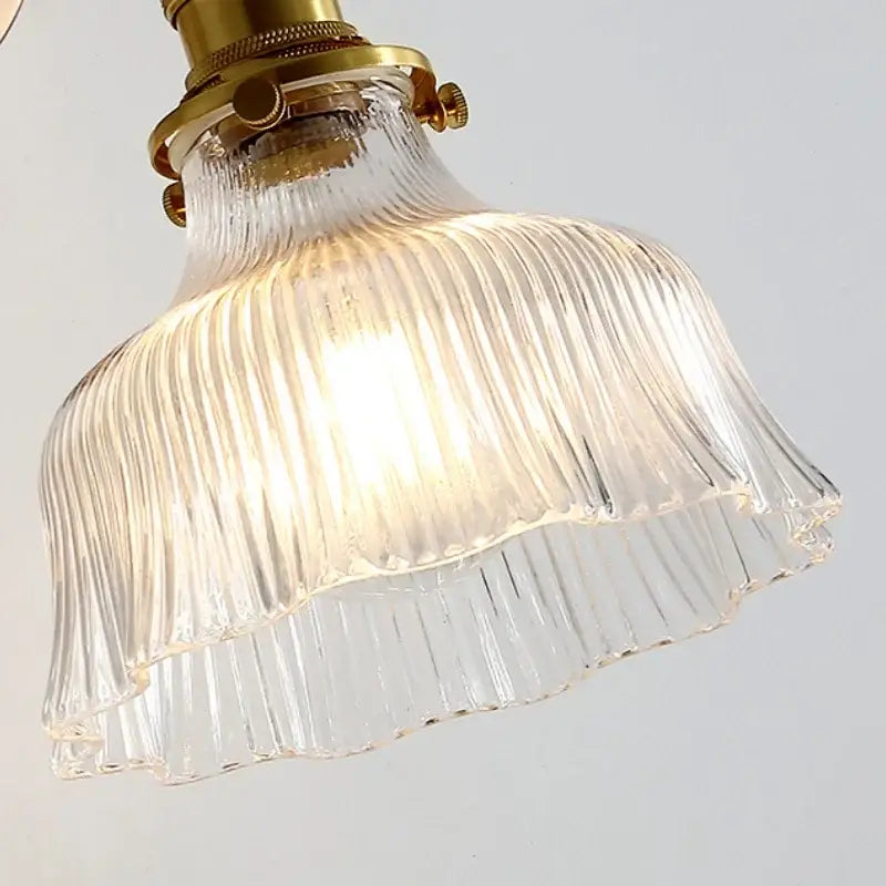 Antique brass wall sconce with clear ribbed glass lampshade featuring glass rotate copper led bedroom lamp design