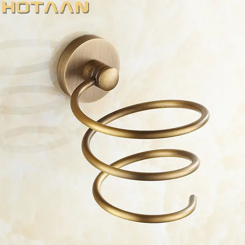 Antique brass hair dryer holder rack featuring a spiral triple loop design with a circular wall-mounted base ideal for bathroom use