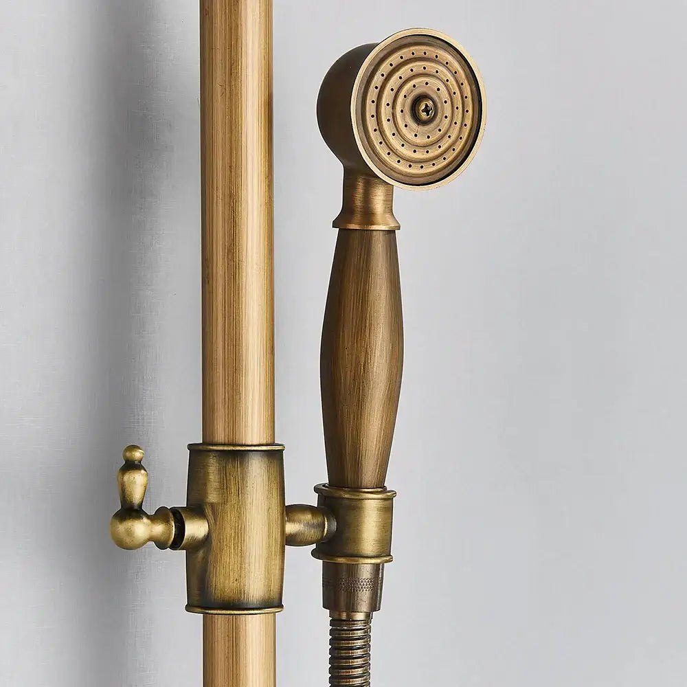 Antique brass handheld rainfall showerhead with brass finish ornate design and textured grip handle for bathroom mixer