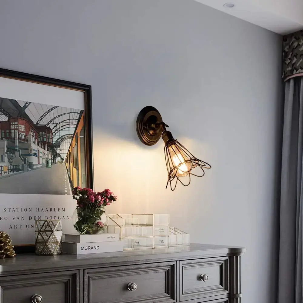 Vintage-style antique brass industrial cage wall sconce with wire cage and exposed bulb for bedroom rustic decorbites industrial cage