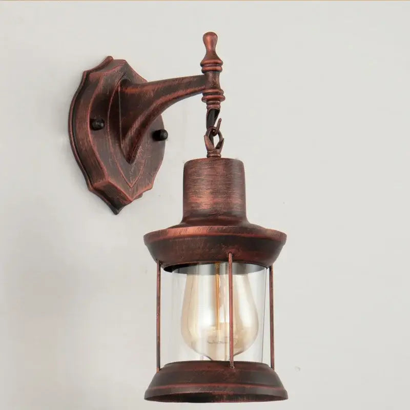 Antique brass industrial glass wall lamp with bronze finish clear glass enclosure and exposed filament bulb decorbites industrial glass wall