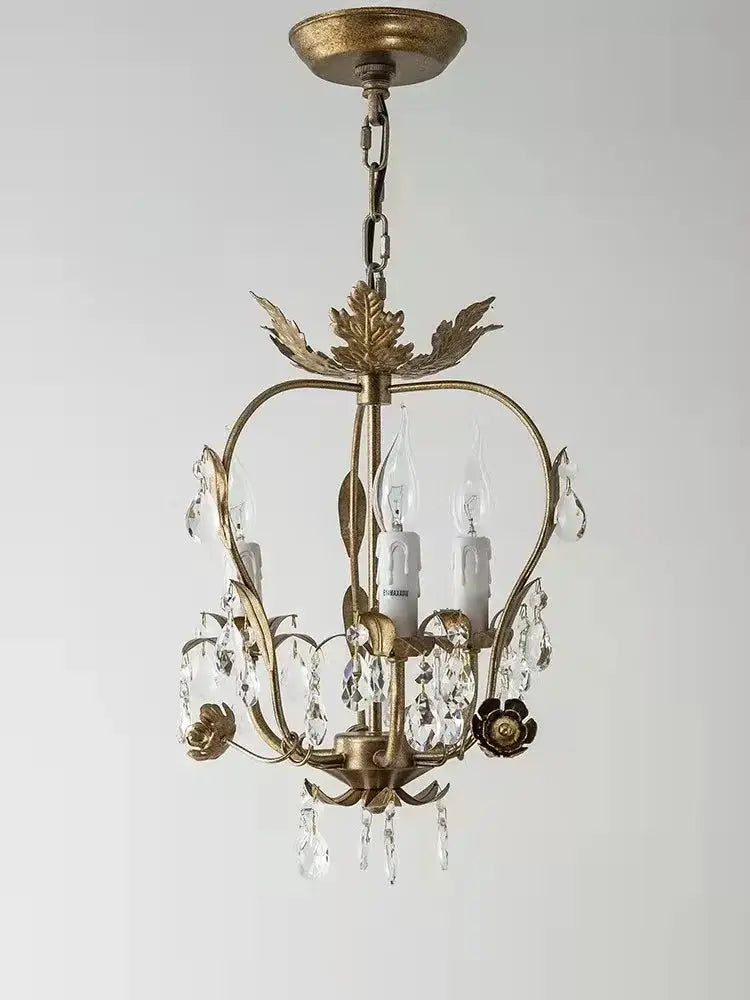 Antique brass iron crystal chandelier with leaf details and crystal droplets for elegant bedroom lighting by decorbites iron crystal