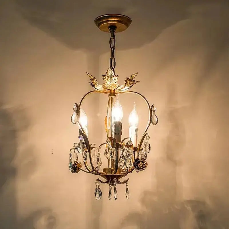 Antique brass iron crystal chandelier with leaf motifs and crystal droplets for bedroom decorbites iron crystal lighting