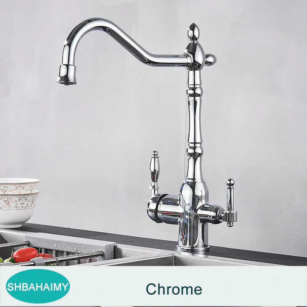 Chrome-finished kitchen faucet with tall ornate spout and dual vintage-style handles in antique brass design