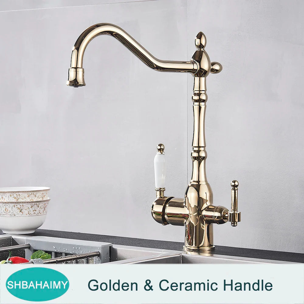 Antique brass kitchen faucet with dual ceramic handles and ornate vintage-inspired design in golden brass finish