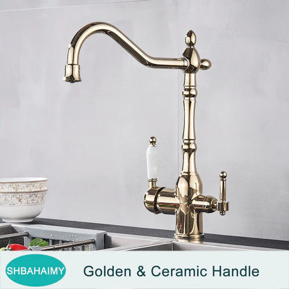 Antique brass kitchen faucet with dual ceramic handles and ornate vintage-inspired design in golden brass finish