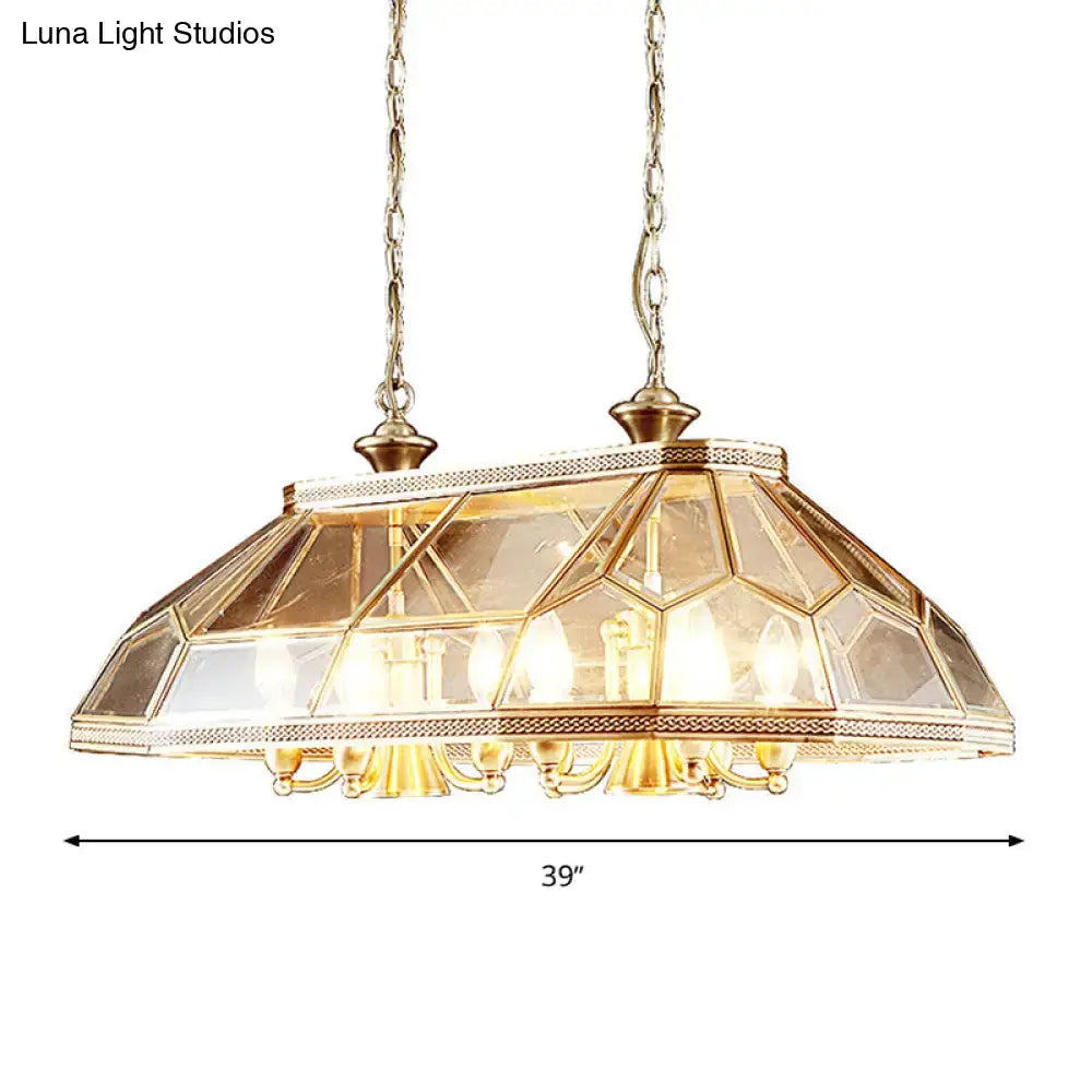 Gold-toned DecorBites™ colonialist faceted living room island light with geometric glass and brass chains fixture height