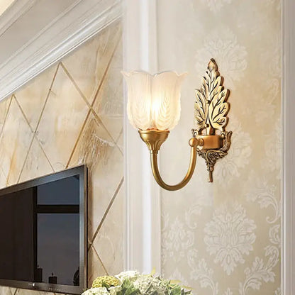 Antique brass leaf tulip wall lamp with gold-toned leaf design and frosted glass shade brass wall lamp decorbites wall lamp