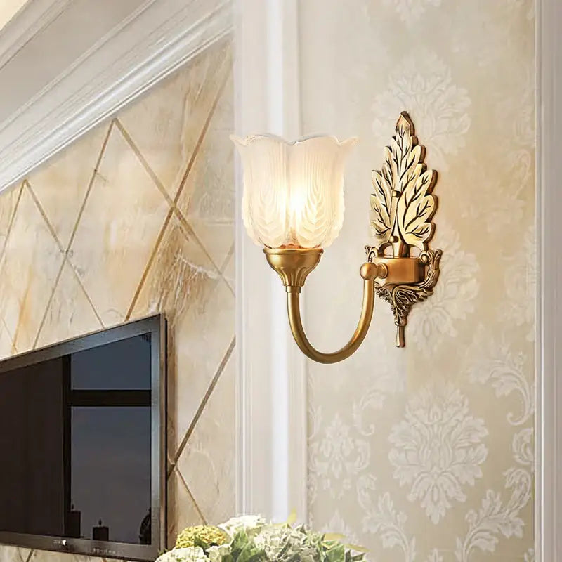 Antique brass leaf tulip wall lamp with gold-toned leaf design and frosted glass shade brass wall lamp decorbites wall lamp