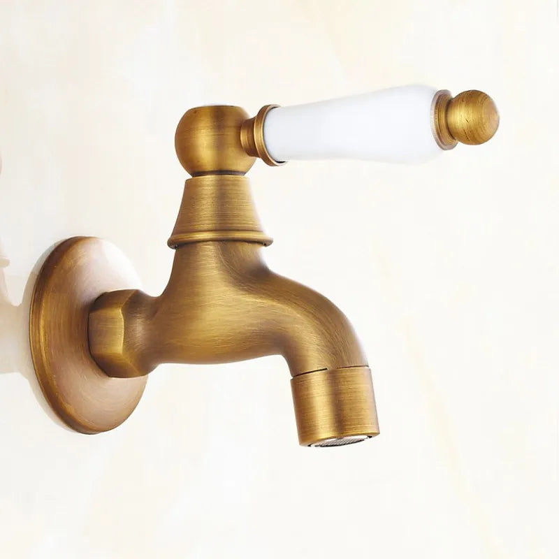 Antique brass outdoor faucet with white ceramic handle single hole wall mount featuring durable housing material