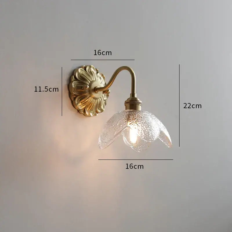 Antique brass wall lights with textured clear ribbed glass shade shaped like an open flower for decorbites ceramic led wall use